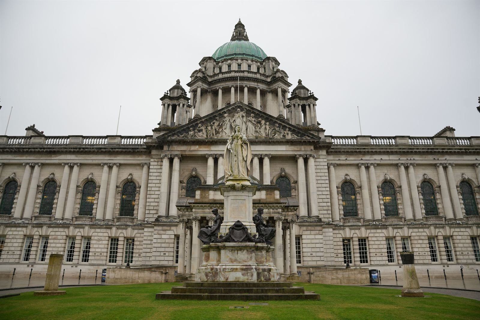 Belfast City Hall with its green copper dome and the statue of Queen Victoria in front